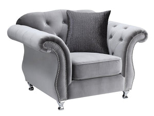 velvet like gray tufed sofa