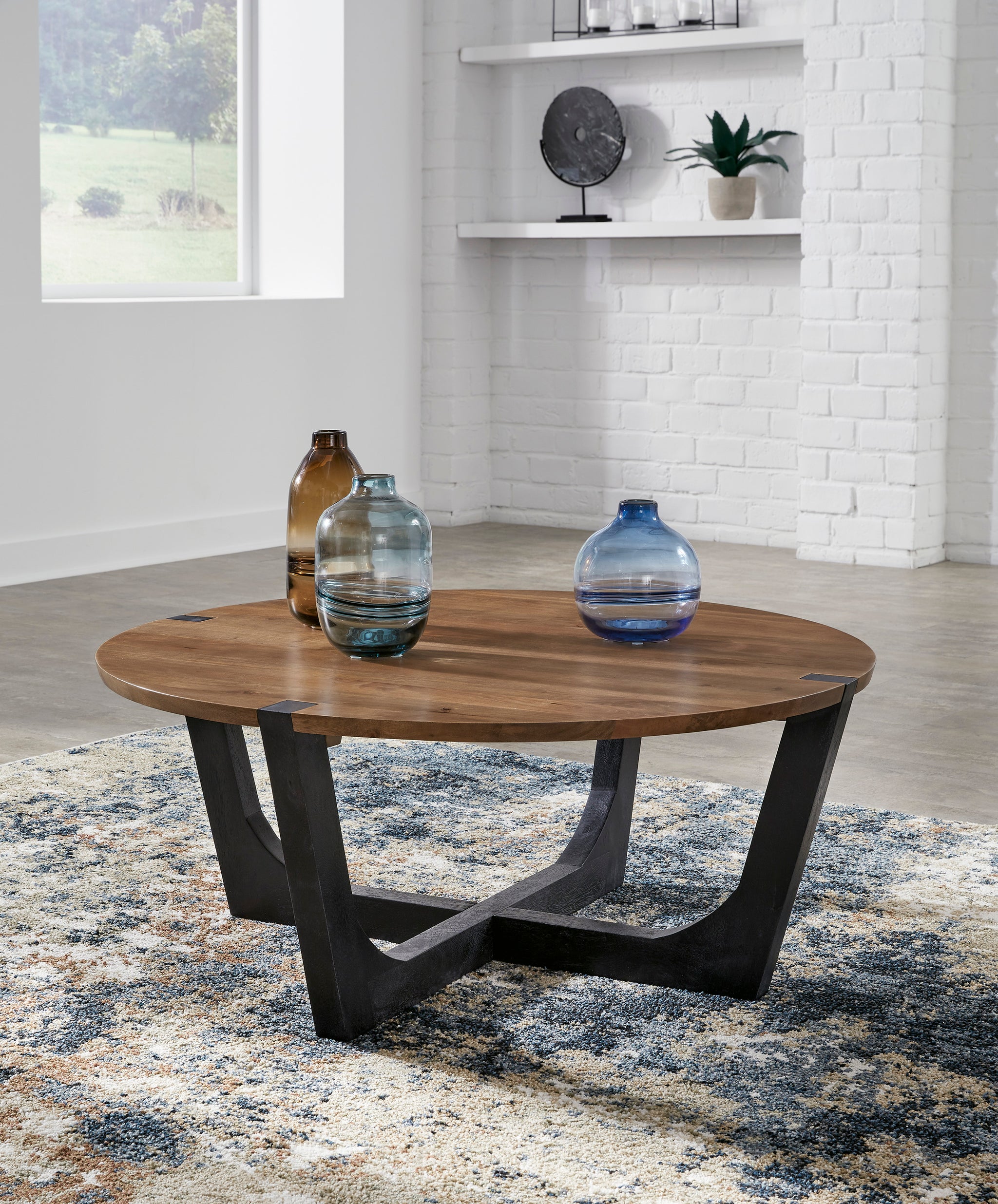 Hanneforth Round Cocktail Table - Brown/Black